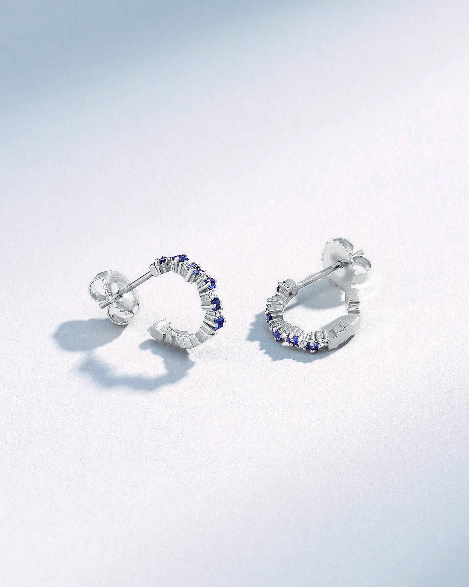 Suzanne Kalan Princess Staggered Dark Blue Sapphire Mini Hoops in 18k white gold