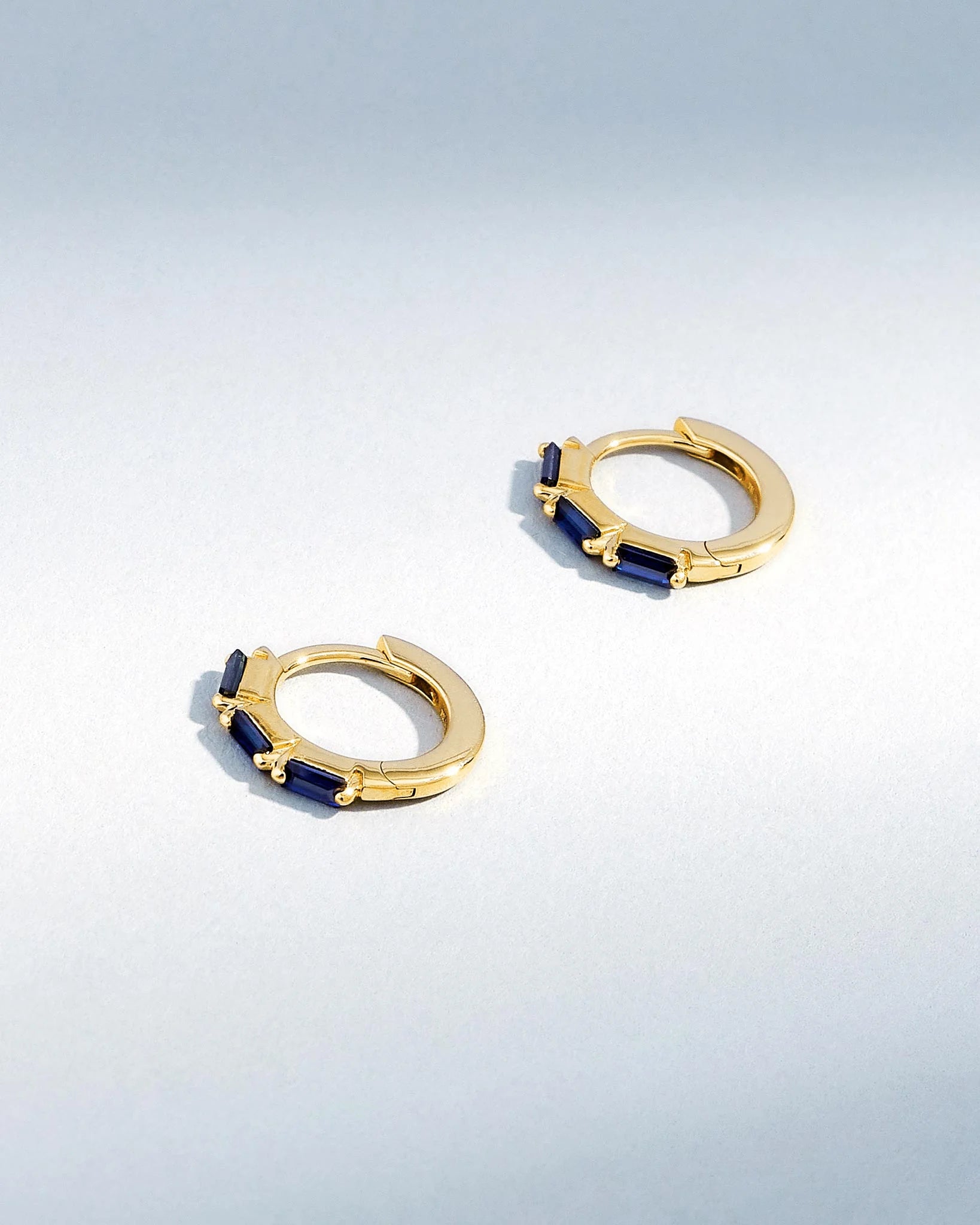 Suzanne Kalan Bold Triple Dark Blue Sapphire Huggies in 18K yellow gold