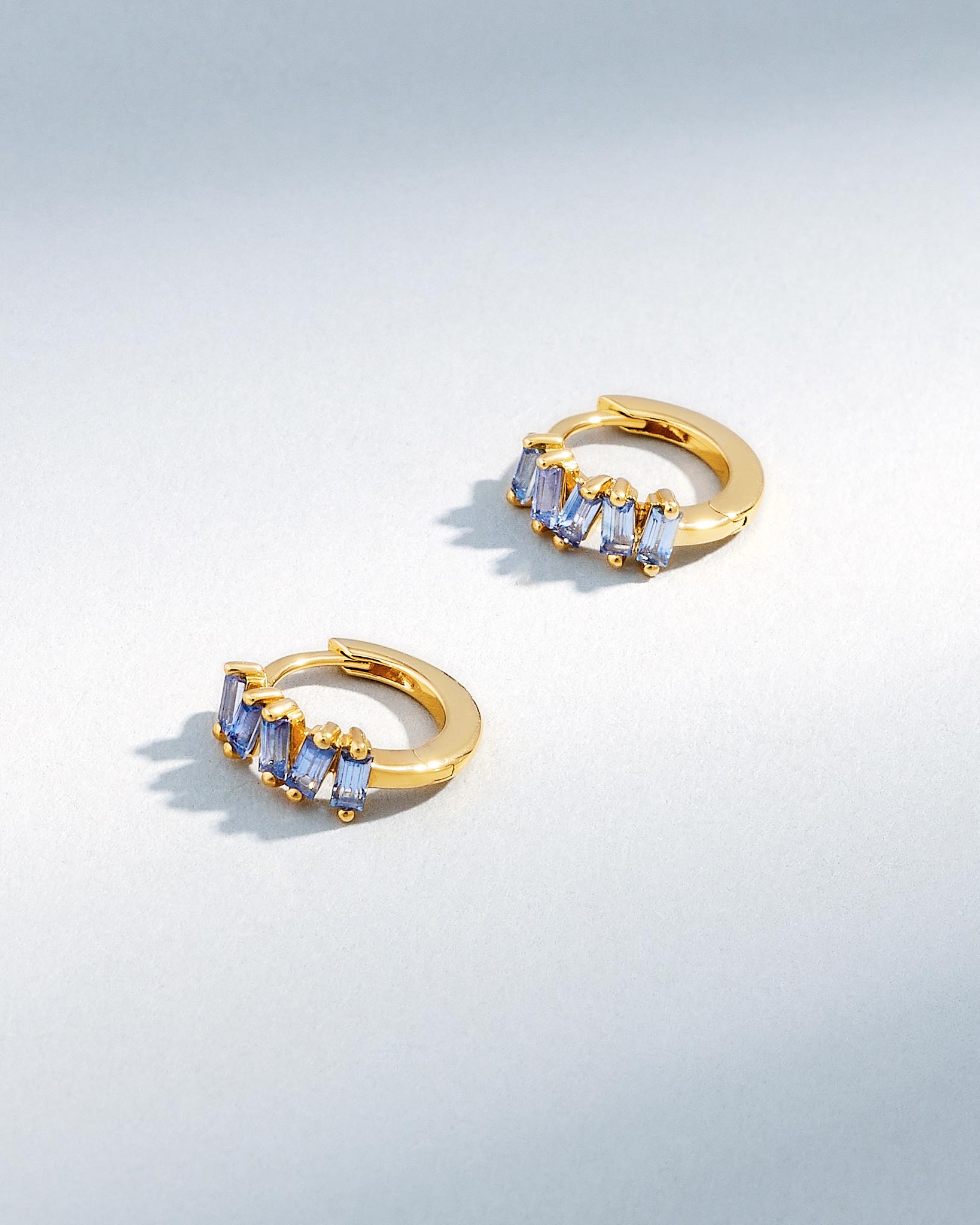 Suzanne Kalan Bold Light Blue Sapphire Huggies in 18K yellow gold