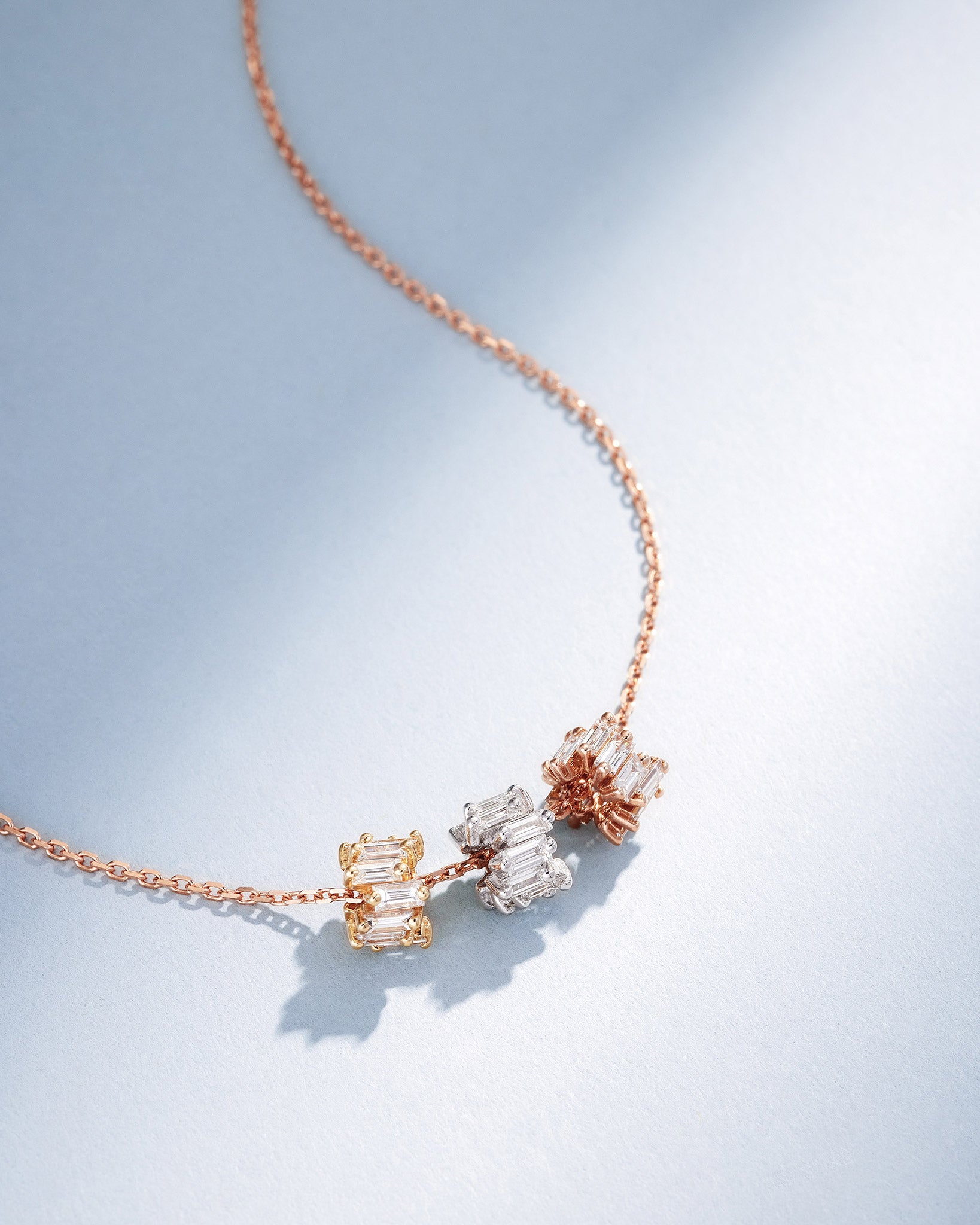 Suzanne Kalan Infinite Triple Diamond Tri-Color Rondelle Pendant with an 18k rose gold chain