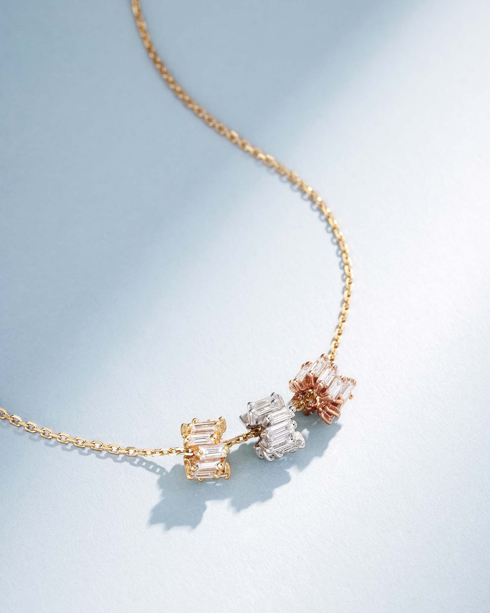 Suzanne Kalan Infinite Triple Diamond Tri-Color Rondelle Pendant with an 18k yellow gold chain
