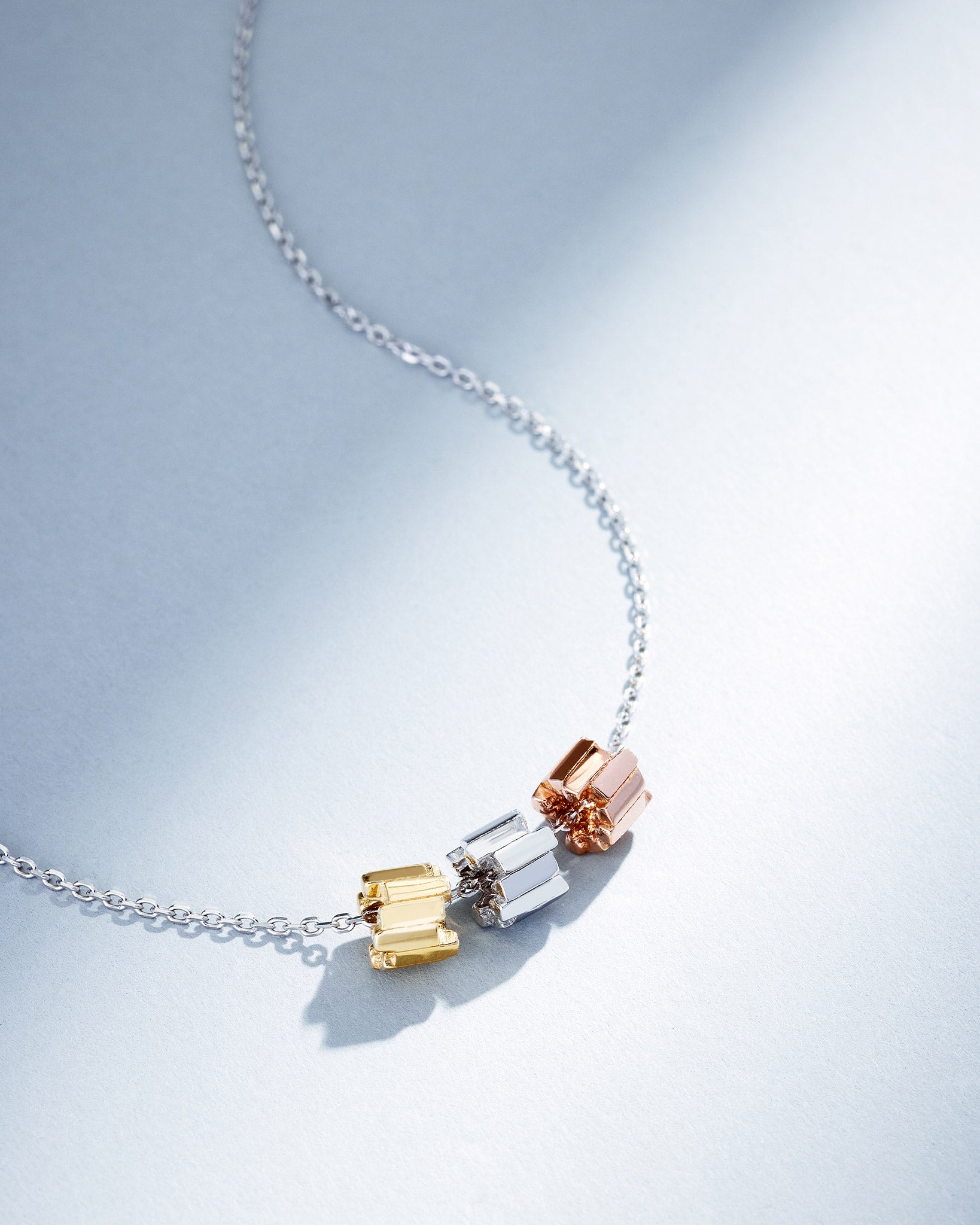 Suzanne Kalan Infinite Triple Golden Mini Tri-Color Rondelle Pendant with an 18k white gold chain