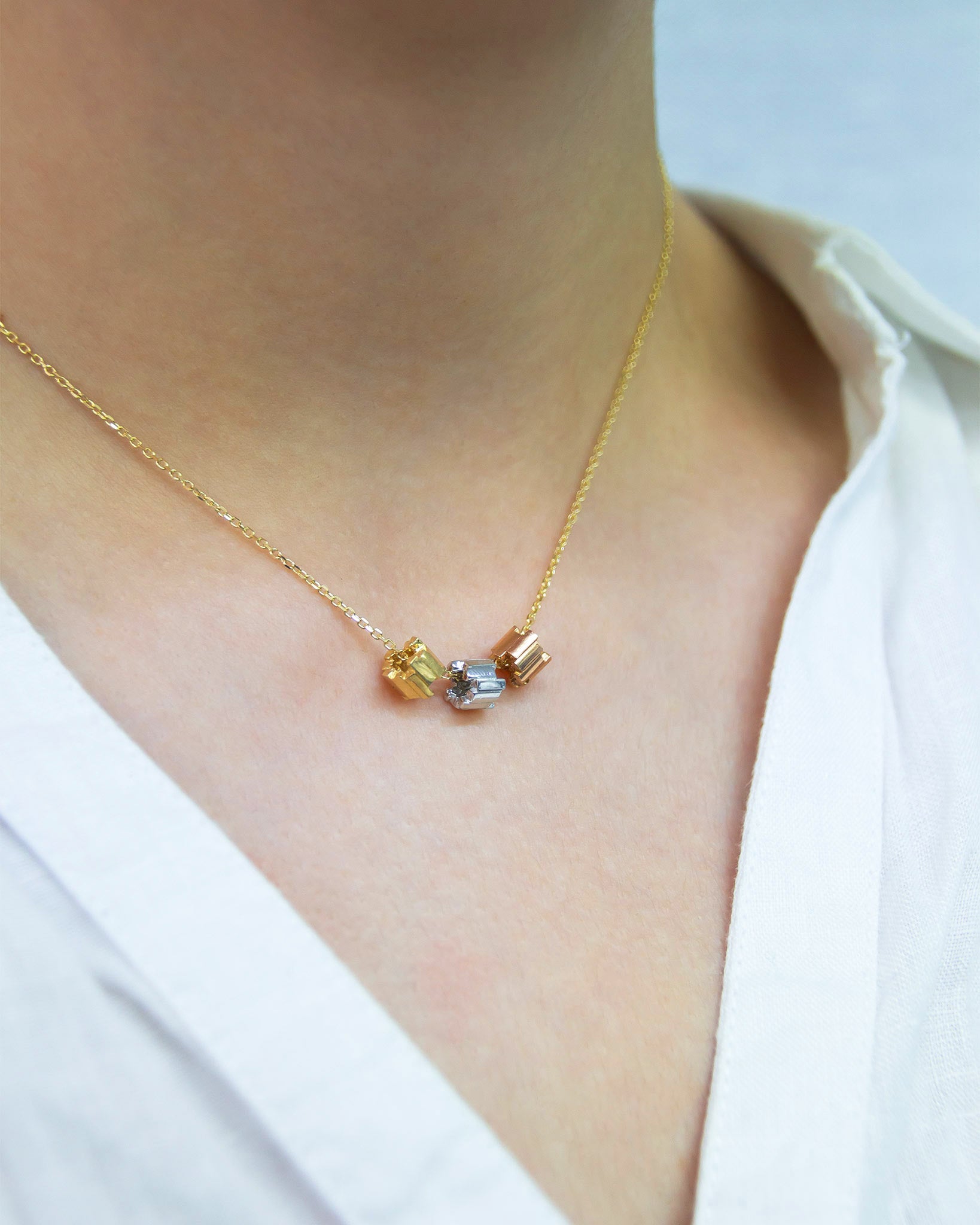Suzanne Kalan Infinite Triple Golden Mini Tri-Color Rondelle Pendant with an 18k yellow gold chain