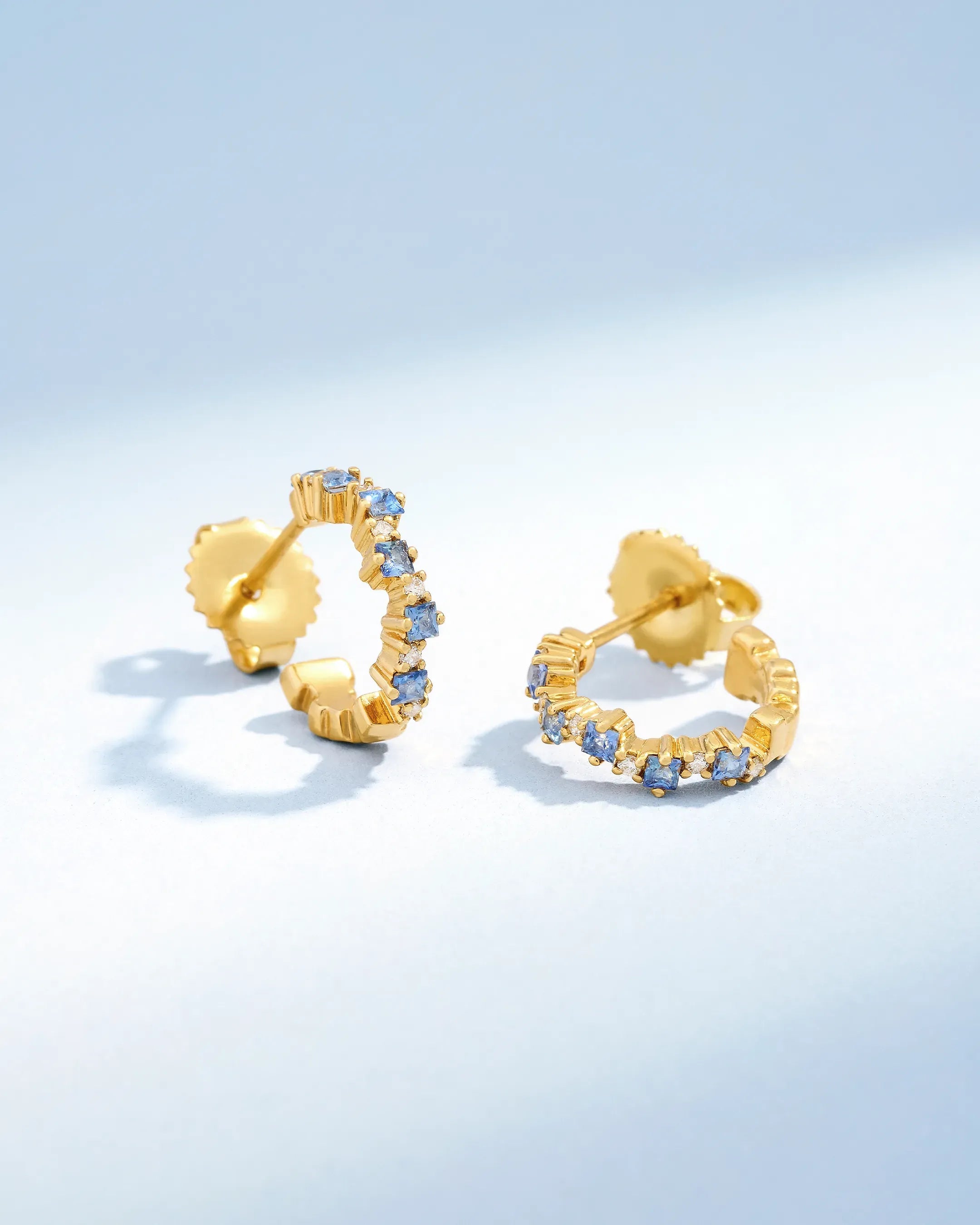 Suzanne Kalan Princess Staggered Light Blue Sapphire Mini Hoops in 18k yellow gold