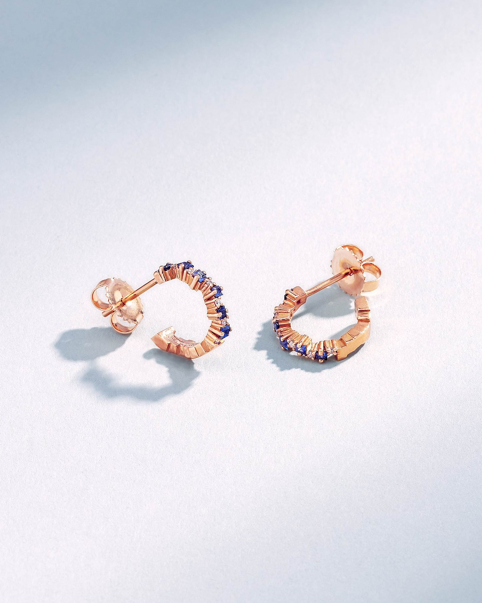 Suzanne Kalan Princess Staggered Dark Blue Sapphire Mini Hoops in 18k rose gold