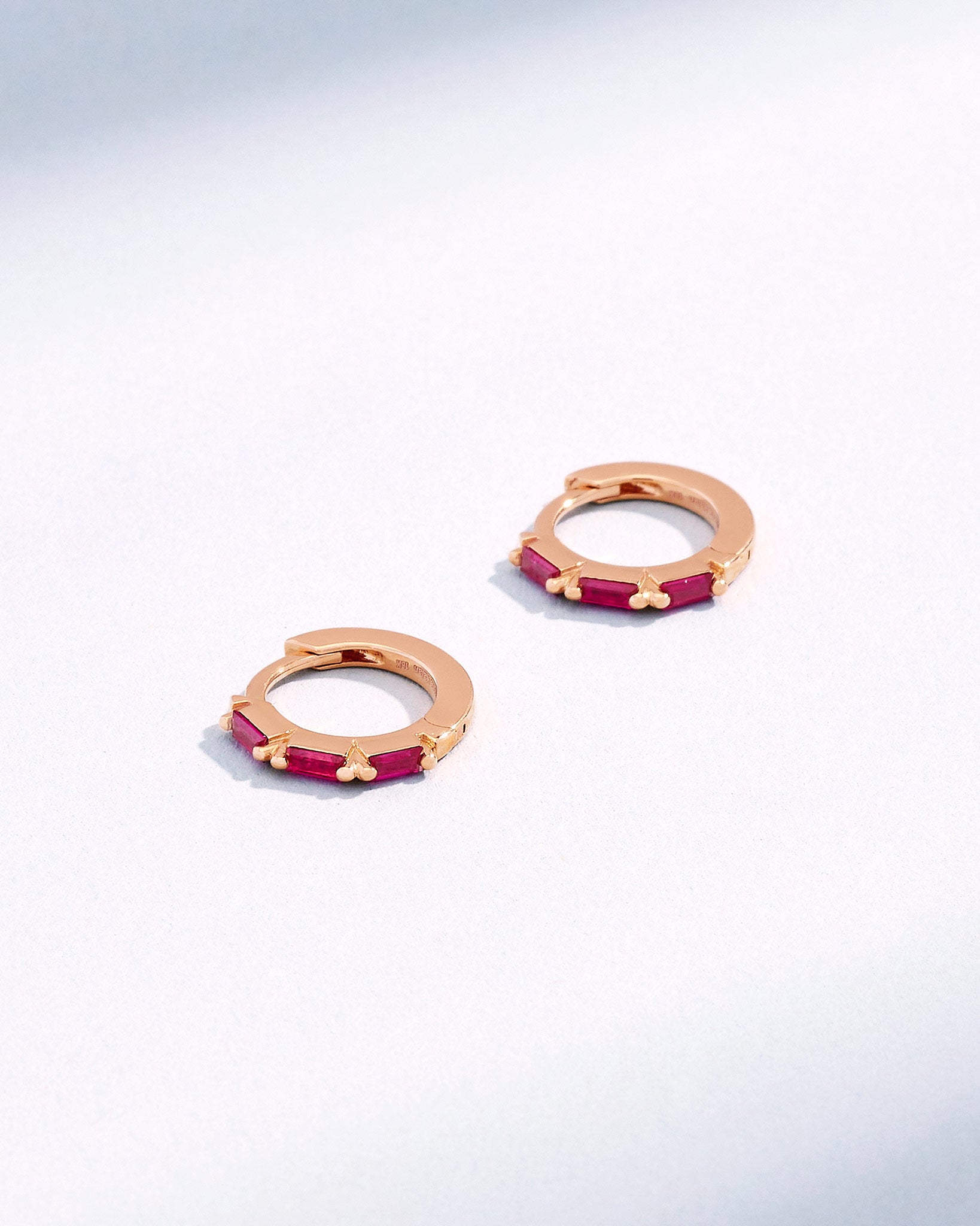 Suzanne Kalan Bold Triple Ruby Huggies in 18K rose gold