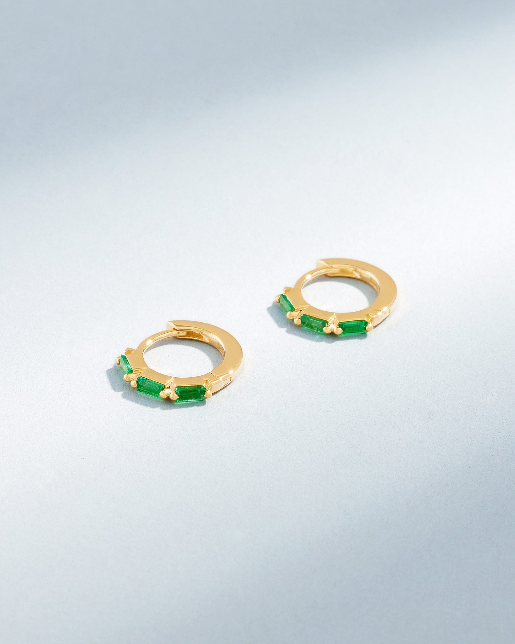 Suzanne Kalan Bold Triple Emerald Huggies in 18K yellow gold