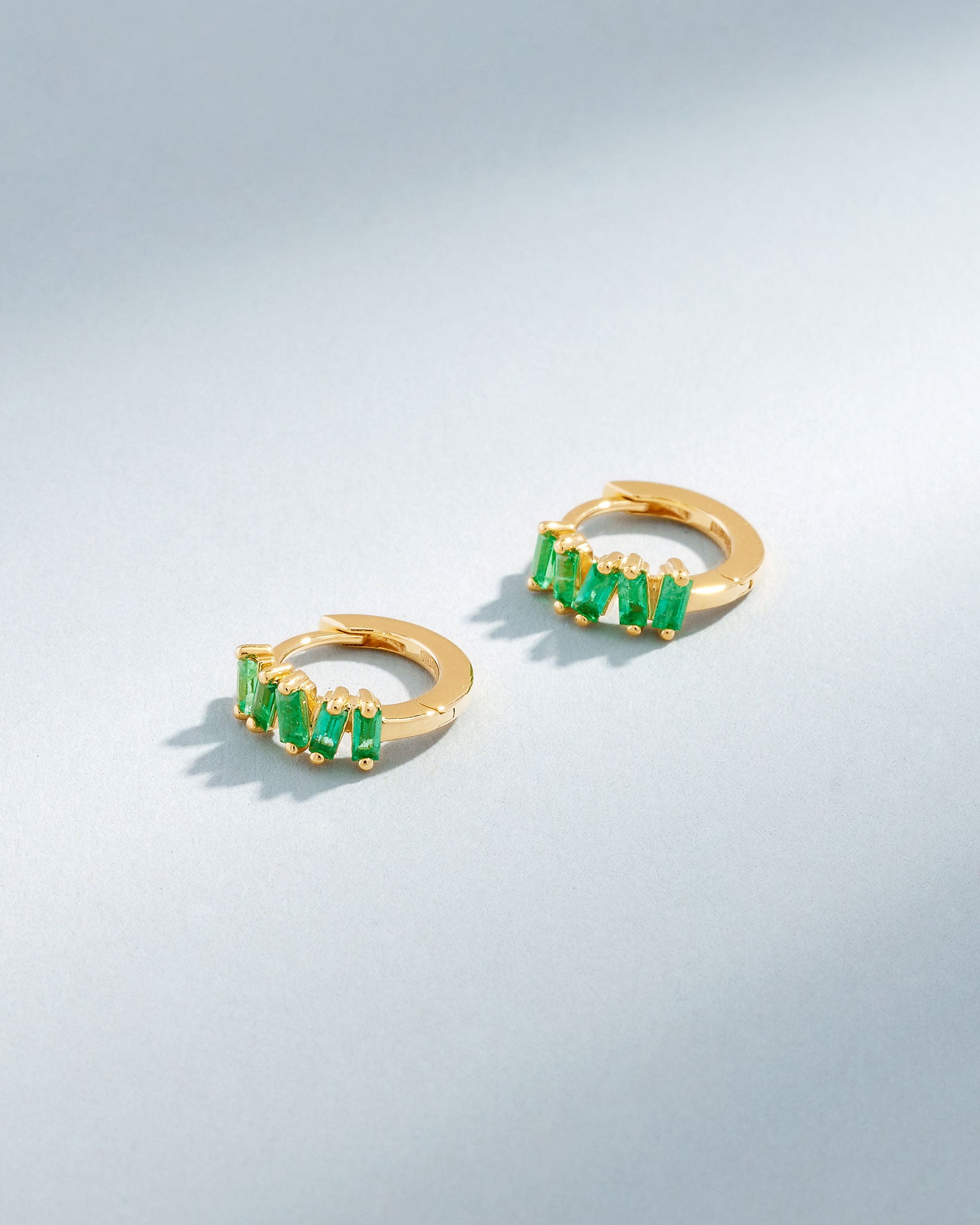 Suzanne Kalan Bold Emerald Huggies in 18K yellow gold