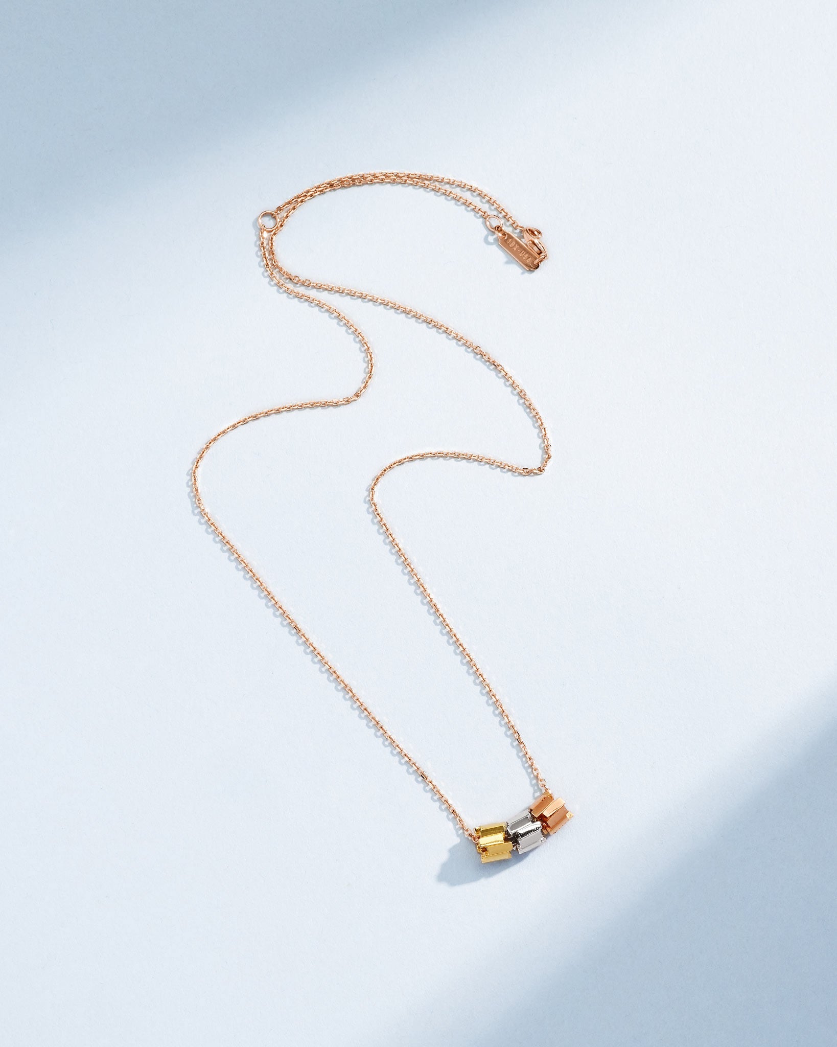 Suzanne Kalan Infinite Triple Golden Mini Tri-Color Rondelle Pendant with an 18k rose gold chain