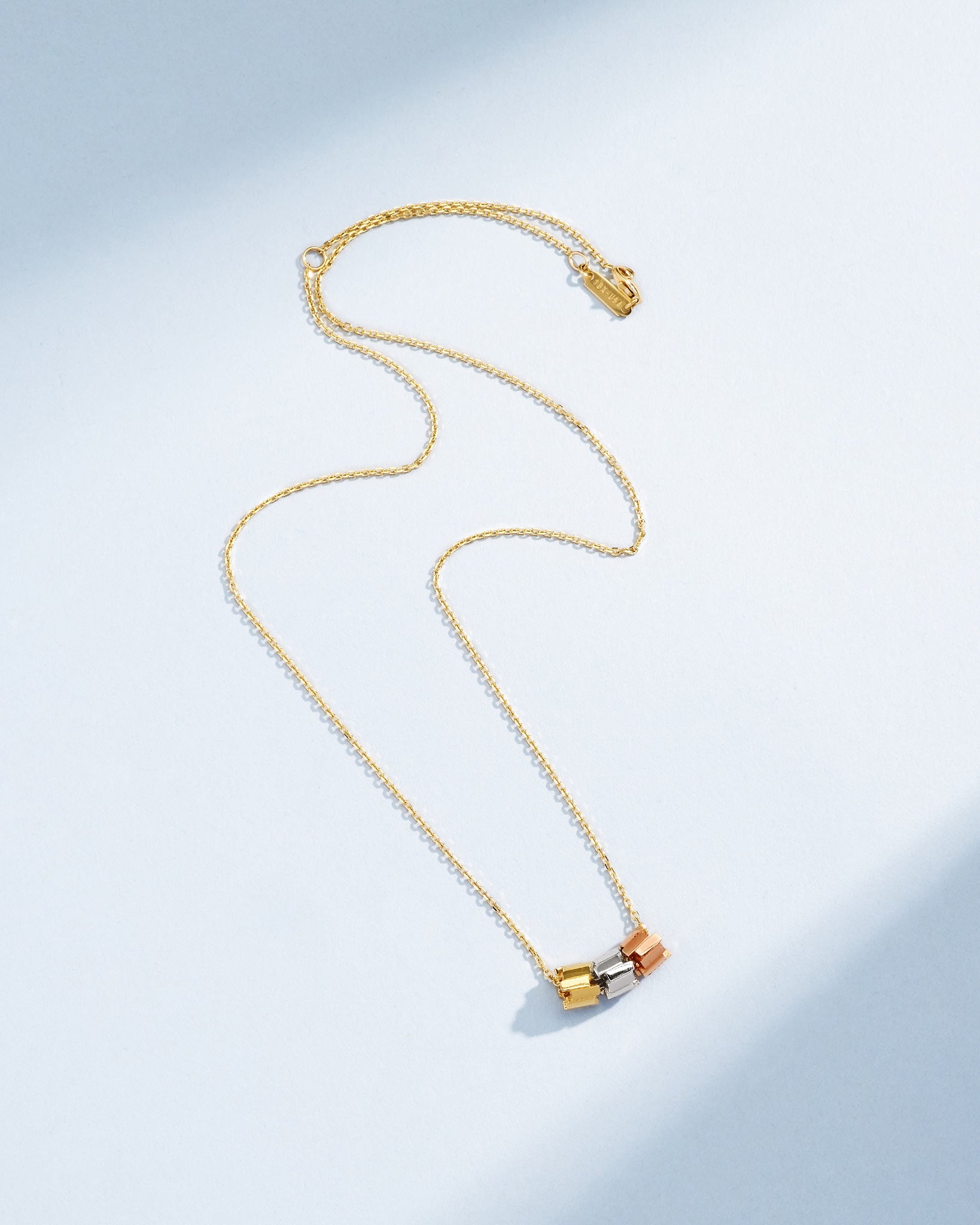 Suzanne Kalan Infinite Triple Golden Mini Tri-Color Rondelle Pendant with an 18k yellow gold chain